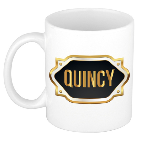 Name mug Quincy with golden emblem 300 ml