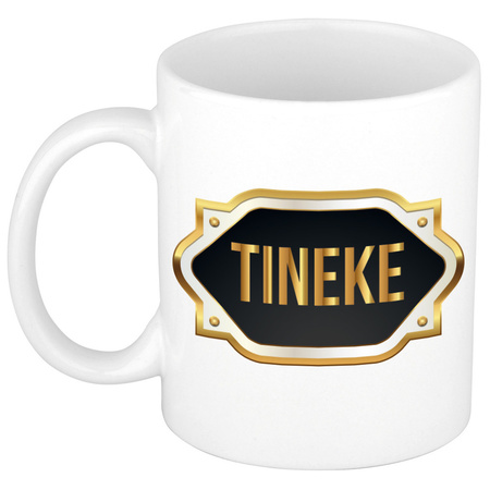 Name mug Tineke with golden emblem 300 ml